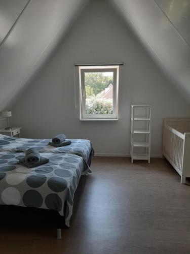 Posteľ alebo postele v izbe v ubytovaní Aanloop 34