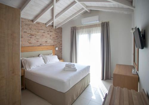 Postel nebo postele na pokoji v ubytování Aktaia Boutique Hotel