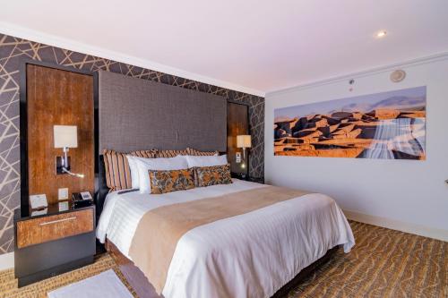 Ліжко або ліжка в номері Hotel Lucerna Ciudad Juarez