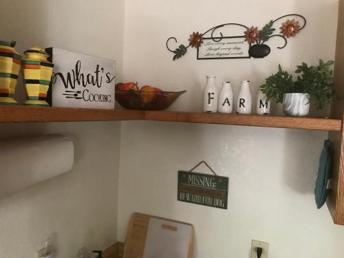 a shelf above a toilet in a room at Grand Canyon Cottage at Historic Wrigley Ranch with Horseback Riding & Hiking in Parks