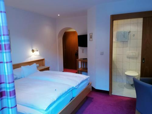Letto o letti in una camera di Haus Marion Haueis