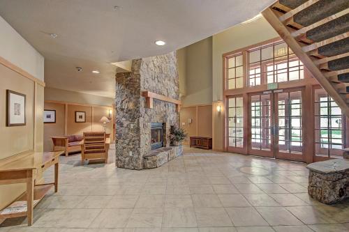 a large living room with a stone fireplace at PP403 Passage Point condo in Copper Mountain