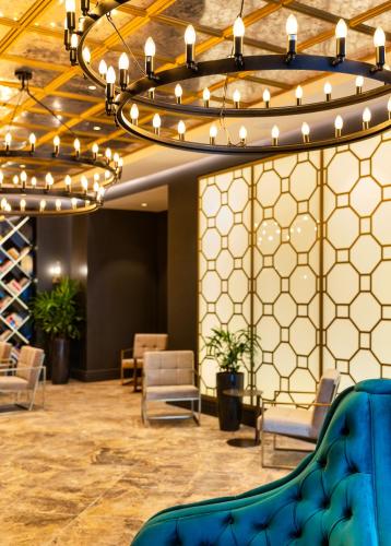 a large room with chairs and a chandelier at Debrah Brown, a member of Brown Hotels in Tel Aviv