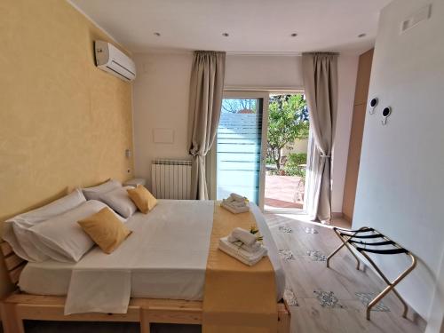 Letto o letti in una camera di La Suscella Bed & Breakfast