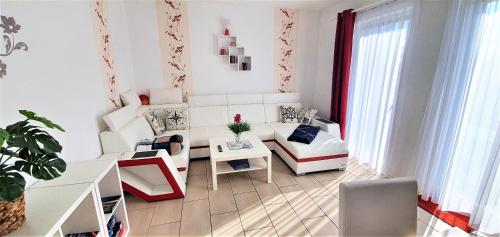 a living room with a couch and a table at Fewo Traum in Neppermin