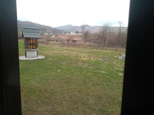 a view of a field from a window at Садиба Федорчуків За рікою1 in Sheshory