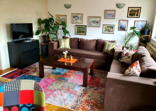 a living room with a couch and a coffee table at Apartment Noah in Sarajevo