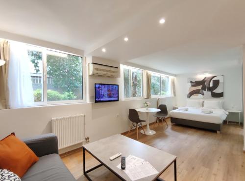 a living room with a couch and a table at Vivo Apartments in Athens