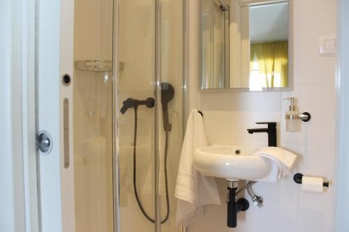a bathroom with a shower and a sink at THE VIEW in Pučišća