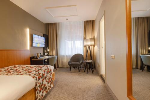 Bilderberg Grand Hotel Wientjesにあるベッド