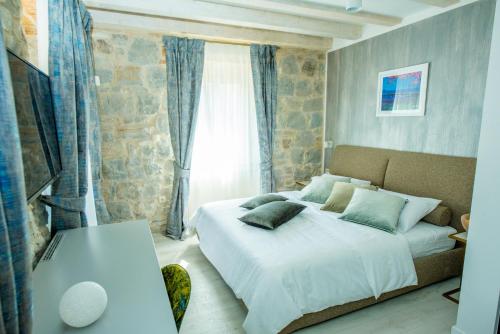 Postel nebo postele na pokoji v ubytování Heritage Villa Vitturi Sea View