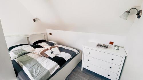 Ένα ή περισσότερα κρεβάτια σε δωμάτιο στο Apartmán Rezidence Rokytnice