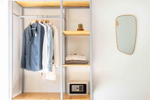 a walk in wardrobe with a mirror and a mirror at SorrentoVibes - Luxury Four Bedroom Home with Amazing Terraces in Sorrento in Sorrento