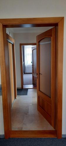 an open door to a room with a living room at Villa Shafaly in Mariánské Lázně