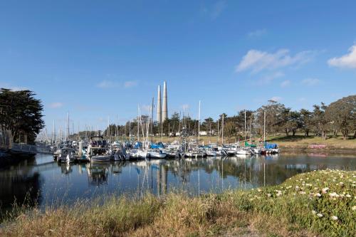 a bunch of boats are docked in a marina at Inn At Moss Landing Point in Moss Landing