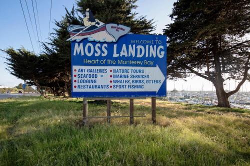 a sign for a moose landing at the beach at Inn At Moss Landing Point in Moss Landing