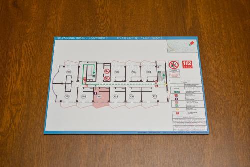 a piece of paper with a plan on a table at Calligraphy Hotel and Cottages in Mtsvane Kontskhi