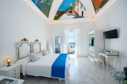 En eller flere senge i et værelse på Terrazza Zaffiro