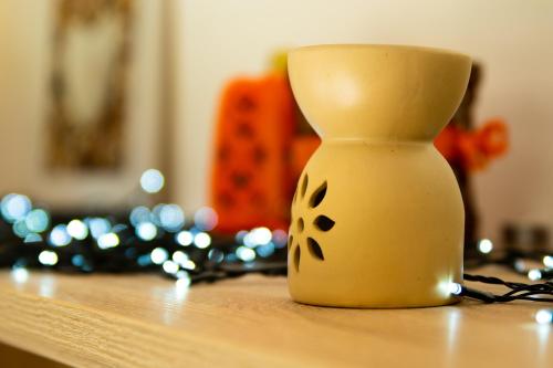 a white vase sitting on top of a table at The Mills Guesthouse in Hatfield