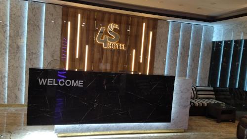 a lobby with a welcome sign on a wall at 4S Hotel Dahab in Dahab