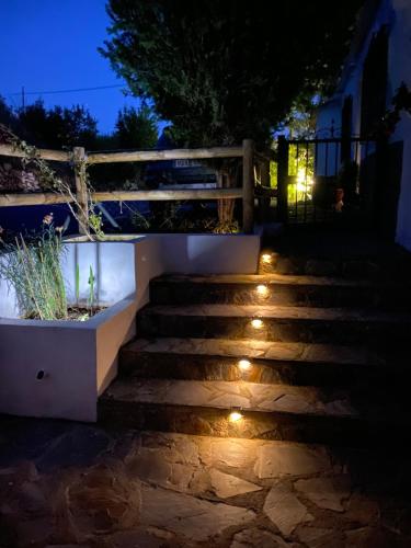 a set of stairs with lights at night at Finca Las Fuentezuelas in Carataunas