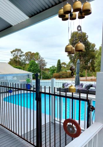 a balcony with a fence and a swimming pool at York Cottages and Burnley House in York
