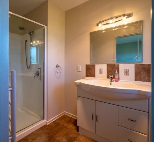 a bathroom with a sink and a shower at 5 Hepburn Lane in Hanmer Springs