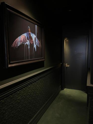 a picture of a pink flamingo on a wall at The Intrepid Hotel in Wellington
