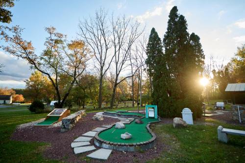 a miniature golf course with a putting green at Spring Gulch Screened Park Model 7 in Mount Airy