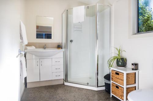 a bathroom with a shower and a sink at Hazards Escape - the Top Shack & the Short Stack in Coles Bay