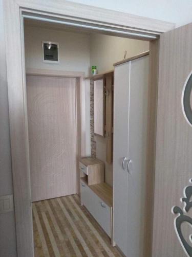 a room with a closet and a door and stairs at Studio in Diamond Beach in Burgas