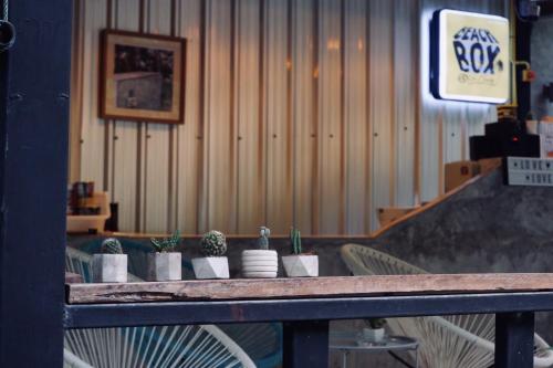 a table with potted plants on it in a room at BeachBox@Koh Сhang in Ko Chang