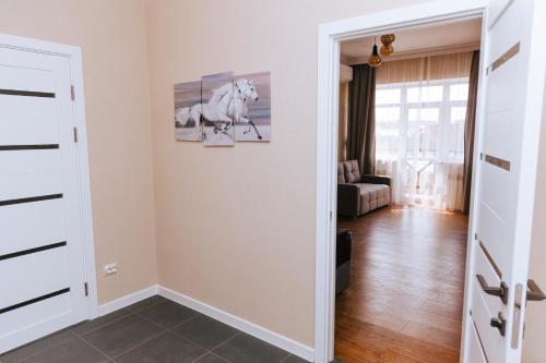 a room with a door open to a living room at Hotel Nika in Essentuki