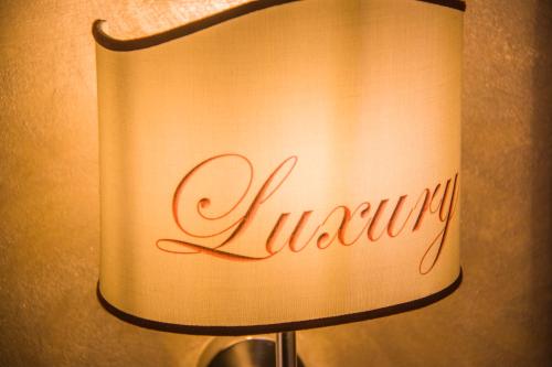 a lamp with the word ivy written on it at B&B Luxury in Lecce
