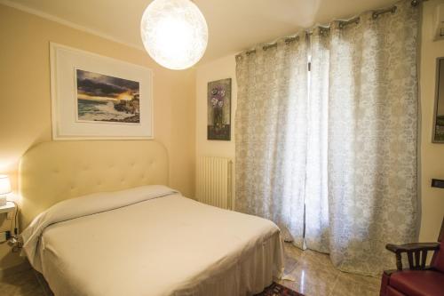 a bedroom with a bed and a large window at B&B Luxury in Lecce