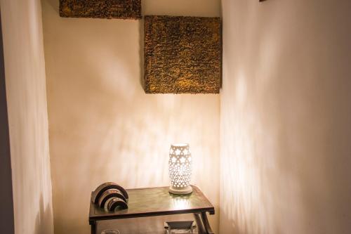 a table with a vase sitting on top of it at B&B Luxury in Lecce