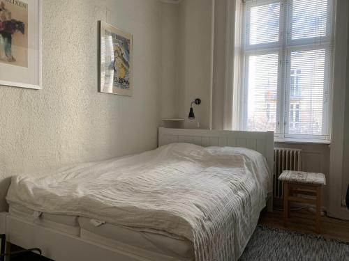 a bedroom with a bed and a window at ApartmentInCopenhagen Apartment 510 in Copenhagen