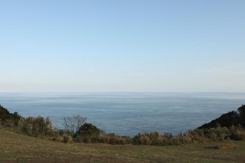 a view of the ocean from the top of a hill at Tsushima Dae-A Hotel in Tsushima