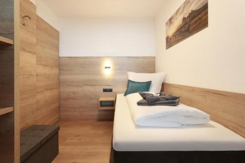 a bedroom with a large white bed in a room at Apart Alina in Schwendau