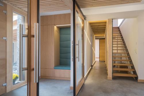 a room with a staircase in a house at Beechtree Property in Izvoare