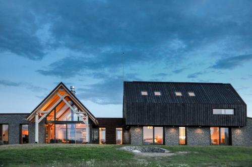 a contemporary house with a black roof at Beechtree Property in Izvoare
