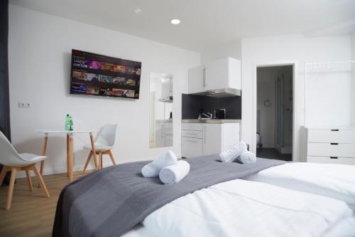 Postel nebo postele na pokoji v ubytování Hamburg Nord Apartments