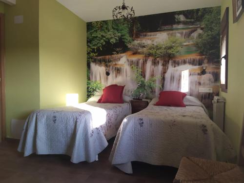 A bed or beds in a room at El Balcon de Peñafiel