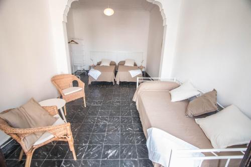 a living room with a couch and chairs and a table at Rotaret in Valencia