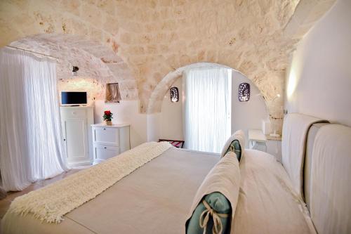 Posteľ alebo postele v izbe v ubytovaní Leonardo Trulli Resort