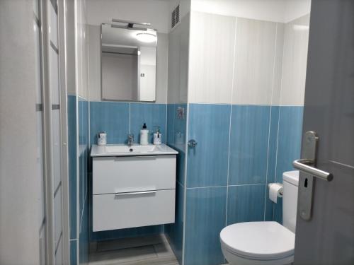 a bathroom with a white sink and a toilet at Casa RITI Mesa del Mar in Tacoronte