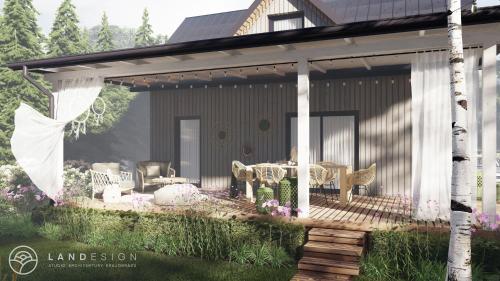 a screened in porch of a house with chairs and tables at Brzozowy Domek in Jarosławiec