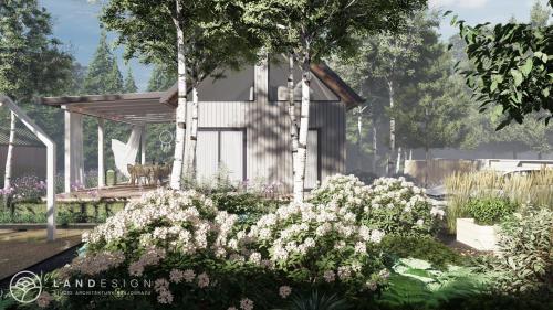 a garden with white flowers in front of a house at Brzozowy Domek in Jarosławiec