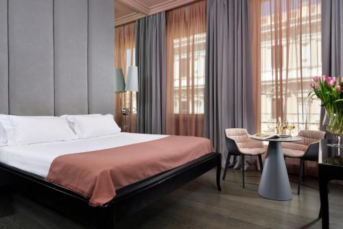 Llit o llits en una habitació de Leon's Place Hotel In Rome
