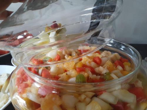 a plastic container of food with vegetables in it at Pousada Araujo Bazilio in Tiradentes